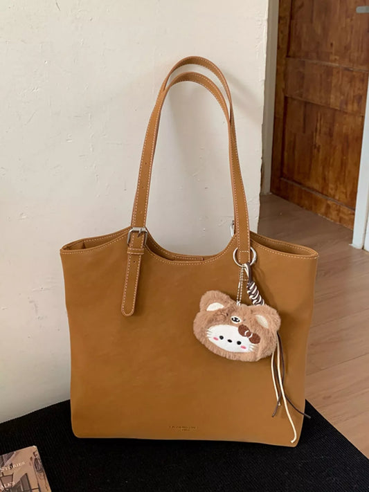 Solid Color Handbag with Plush Charm